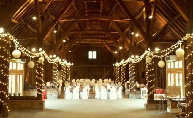 Wind Around The Wooden Pillars | 21 Stunning Wedding Lighting Ideas Using Festoon And Fairy Lights