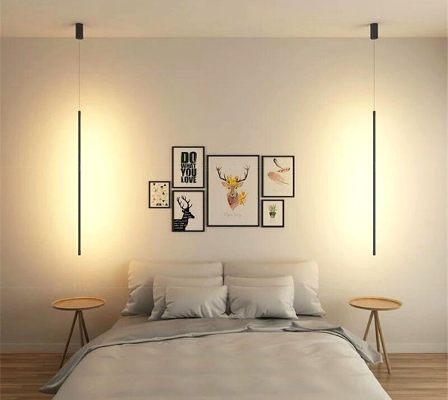 two elongated lamps hanging on both sides of the bed
