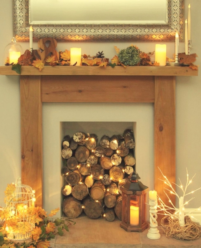firewood and fairy lights in the old fire place