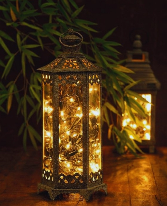 repurposed rustic lantern made of glass and copper decorated with fairy lights