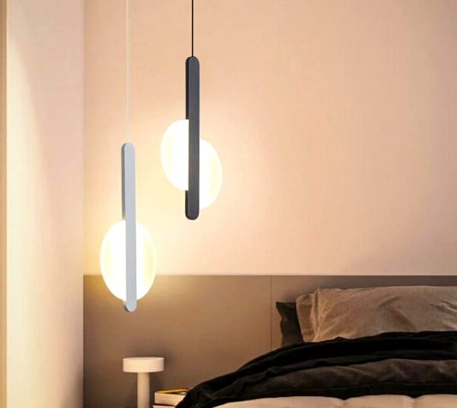 scandinavian LED lamps hanging on top of the bedside